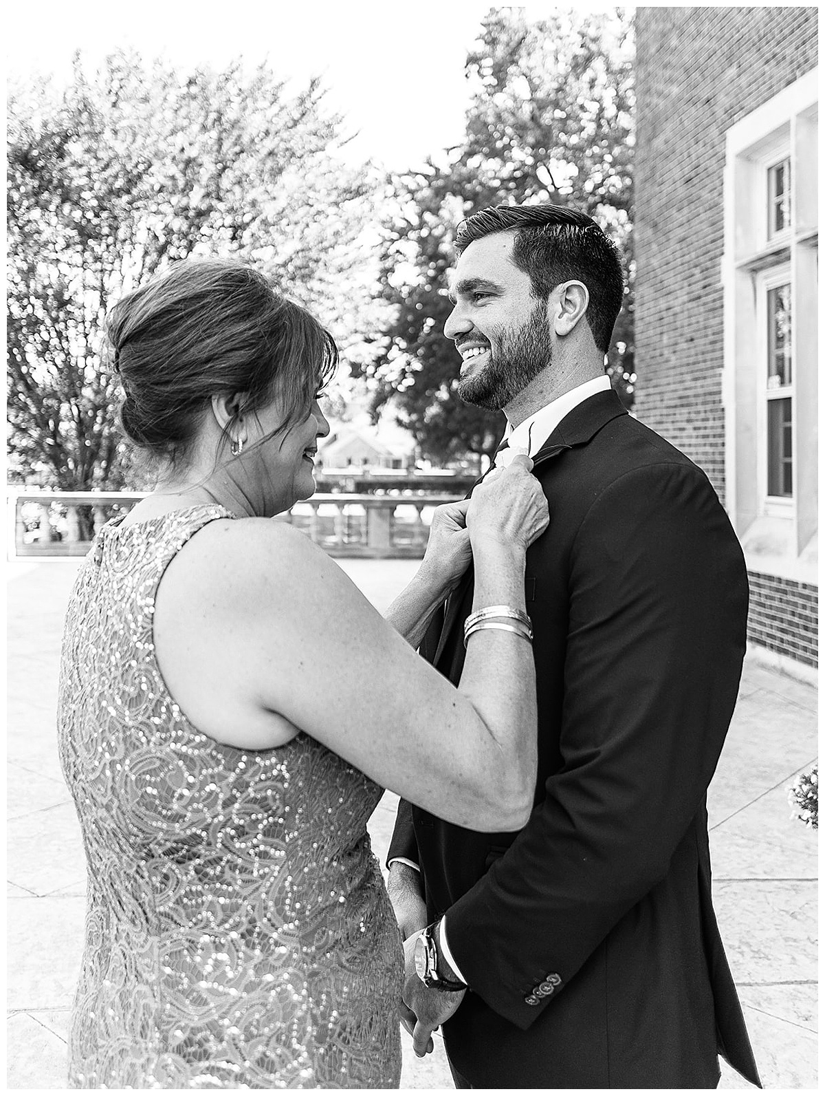 Mom helps son with flower for Kayla Bouren Photography
