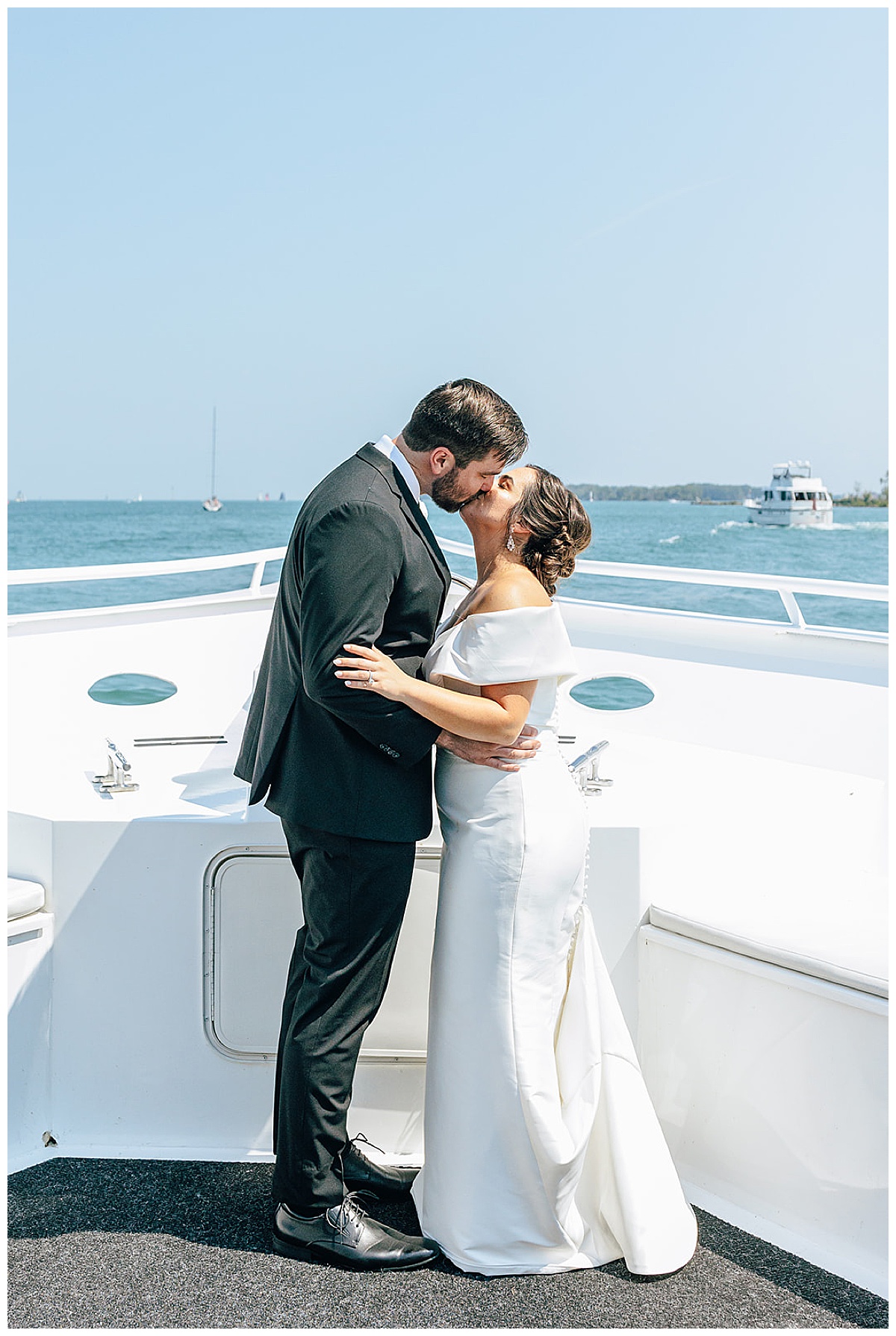 Bride and groom share a kiss on their Yacht Charter Wedding 