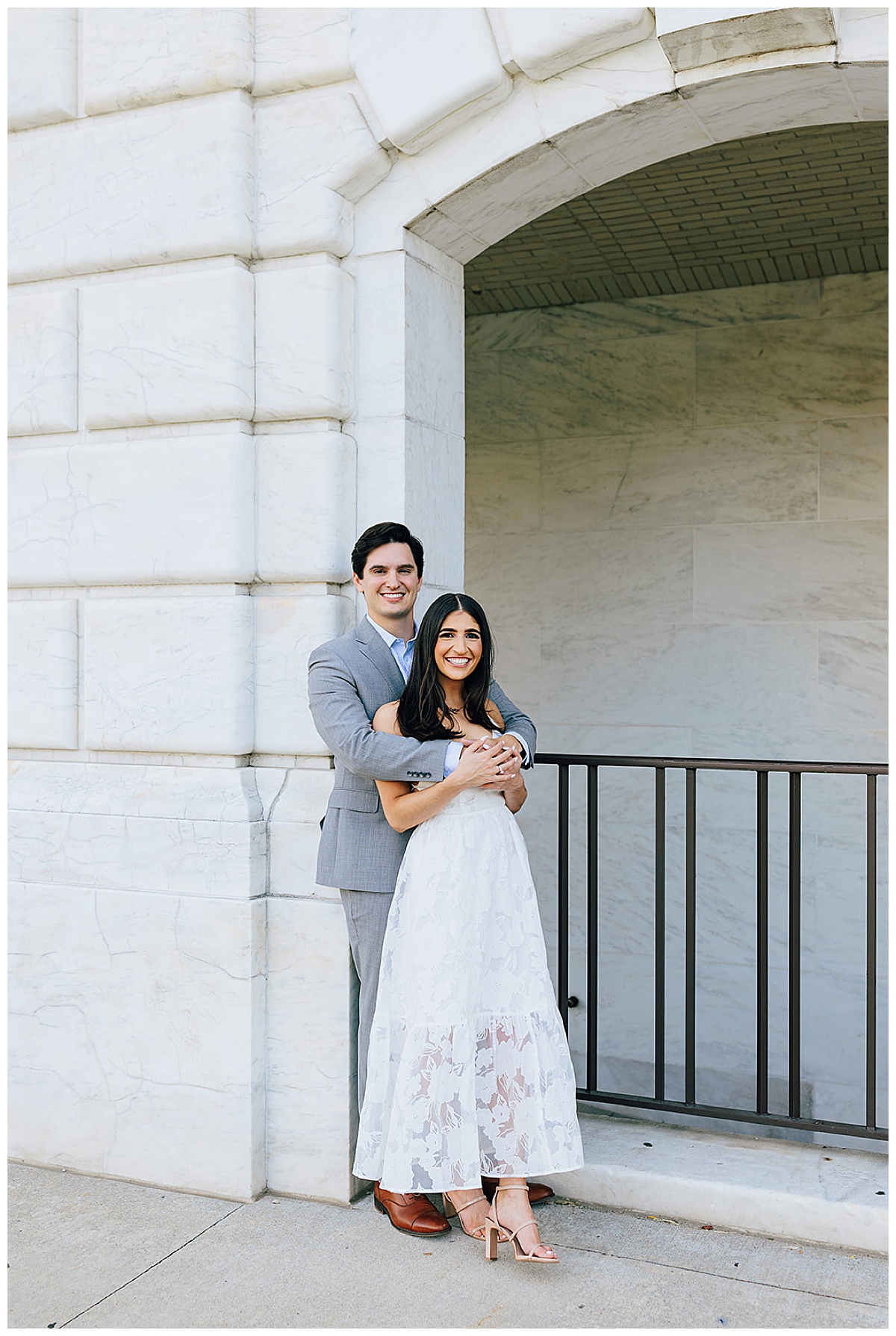 Man holds woman close as they share big smiles for Kayla Bouren Photography