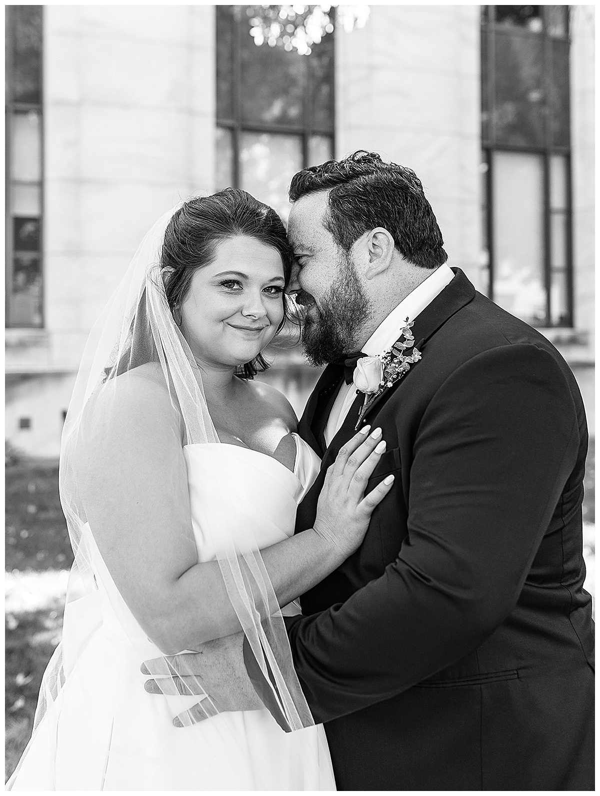 Bride and groom share a hug for Kayla Bouren Photography