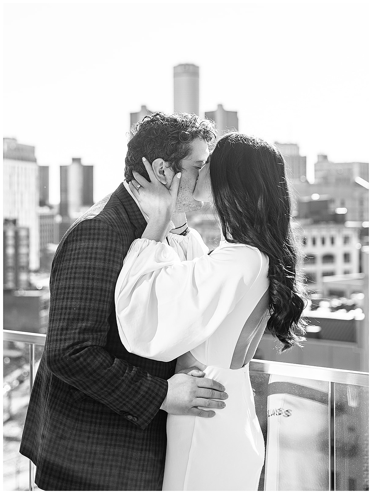 Woman kisses man's cheek for Kayla Bouren Photography