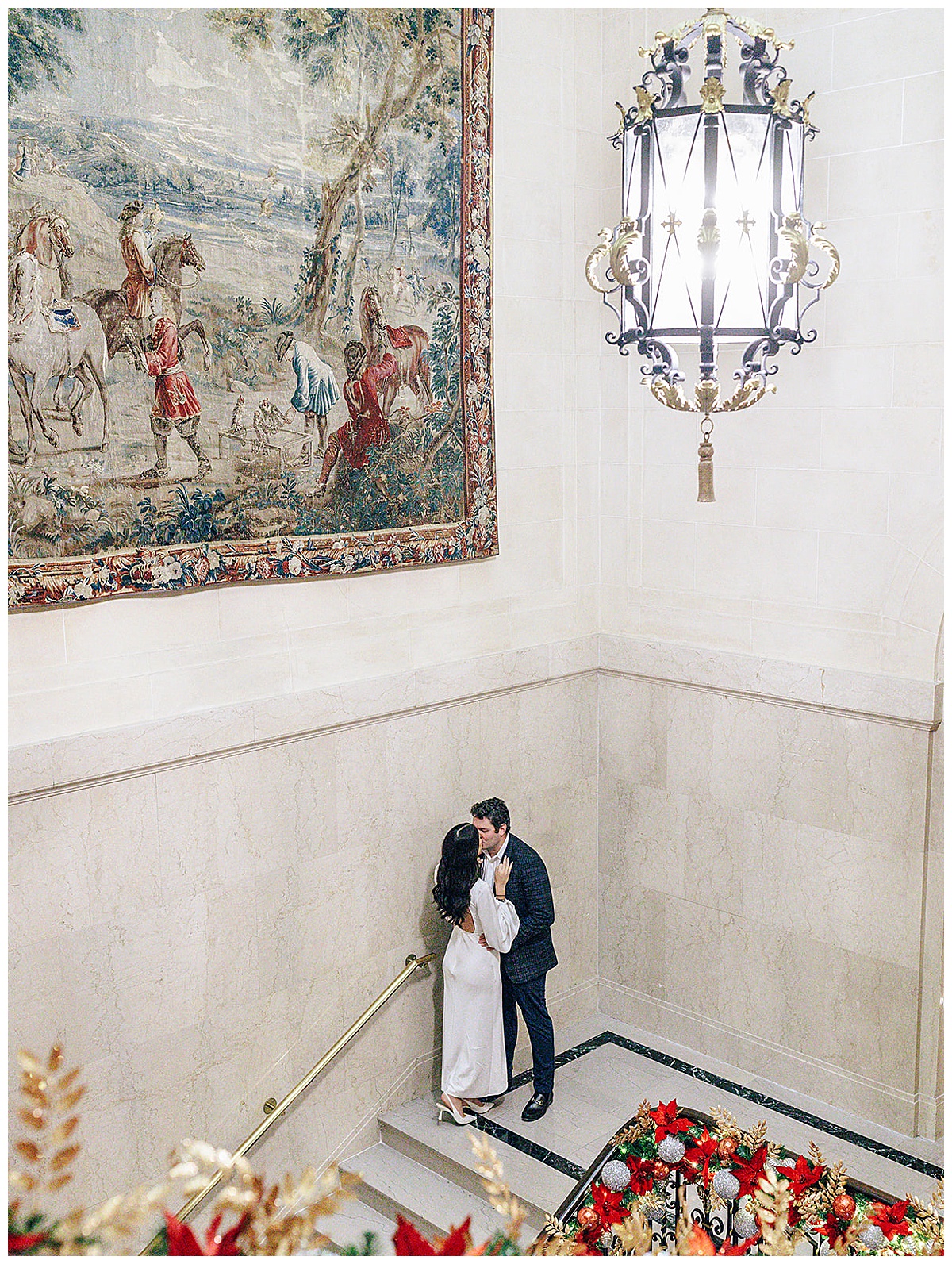Couple share a kiss on a staircase for Detroit Wedding Photographer